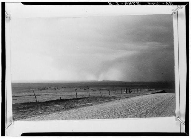 Dust storm sweeping over farmland