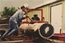 Photo of Bjorn Karlsson running logs through a portable sawmill